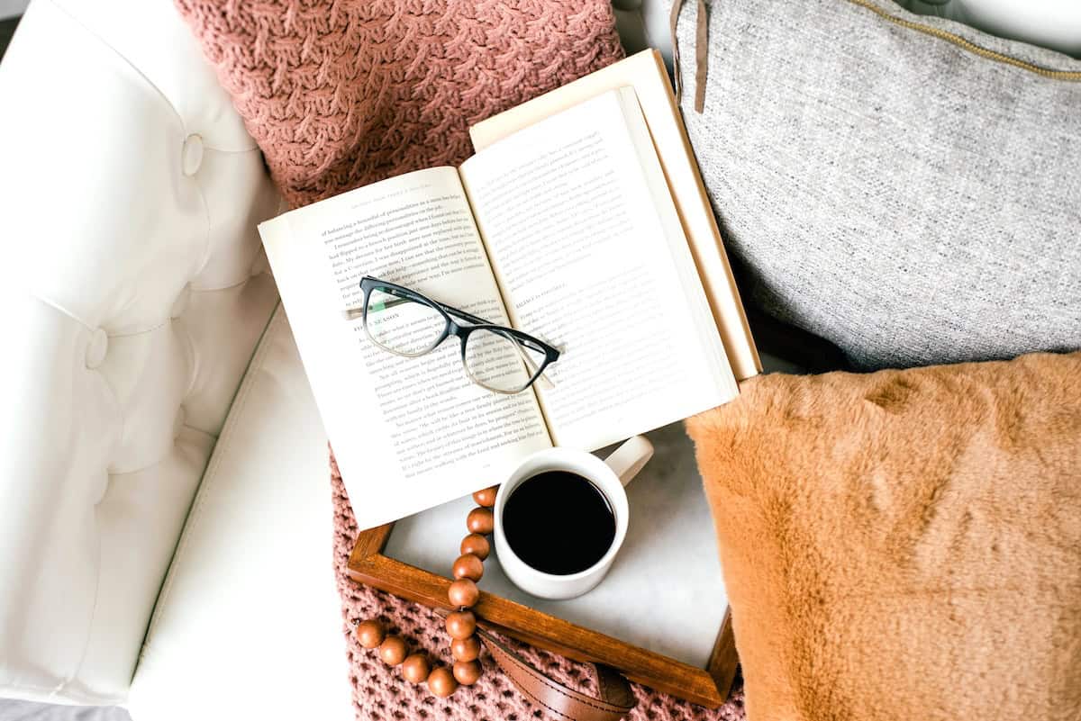 Books on sofa, coffee, cushions - weekly reset items.