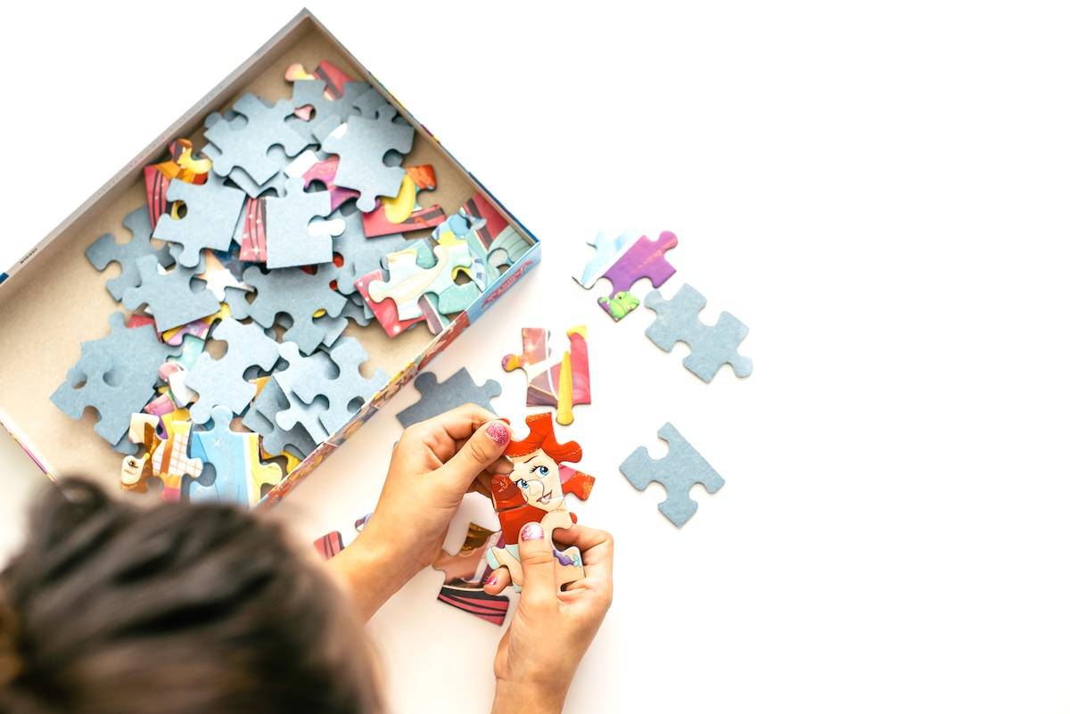 Child doing a puzzle - ideas for Christmas stocking stuffers.