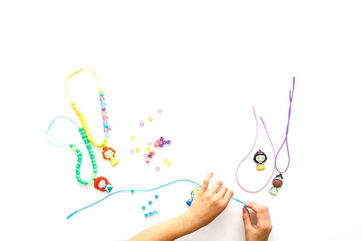 Kid playing with beads - ideas for Christmas stocking stuffers.