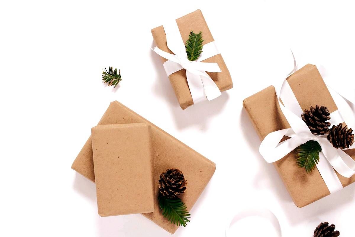 3 gifts with ribbon and pinecones - things to put in Christmas planner.