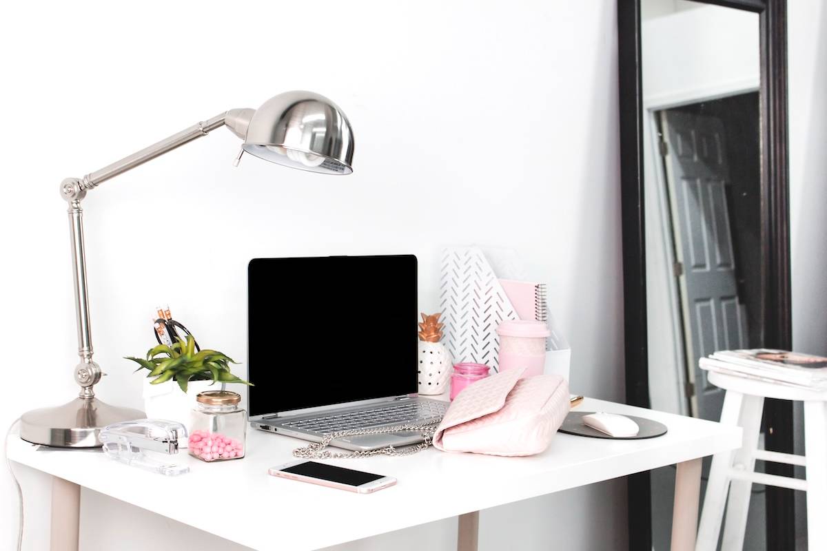 Office with lamp, stationery, and laptop - items you need to be organised.