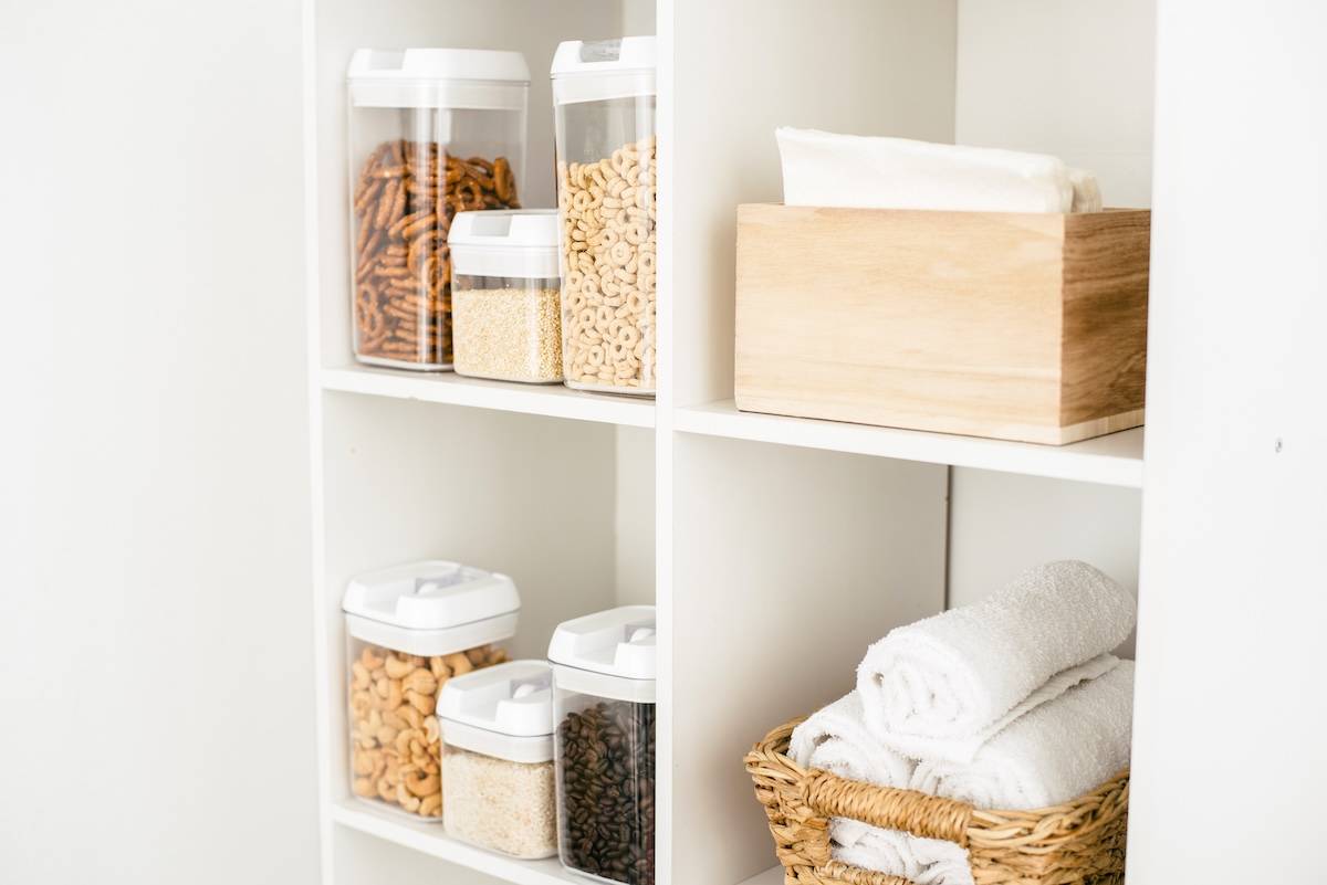 Cupboard with cereal, towels - items needed for a Sunday reset routine.
