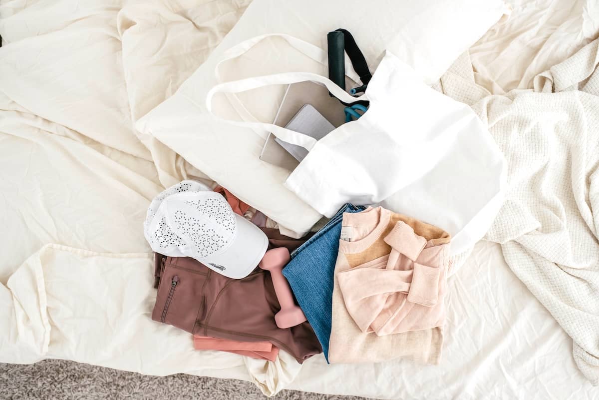 Pile of clothing and makeup - guide to decluttering clothes.
