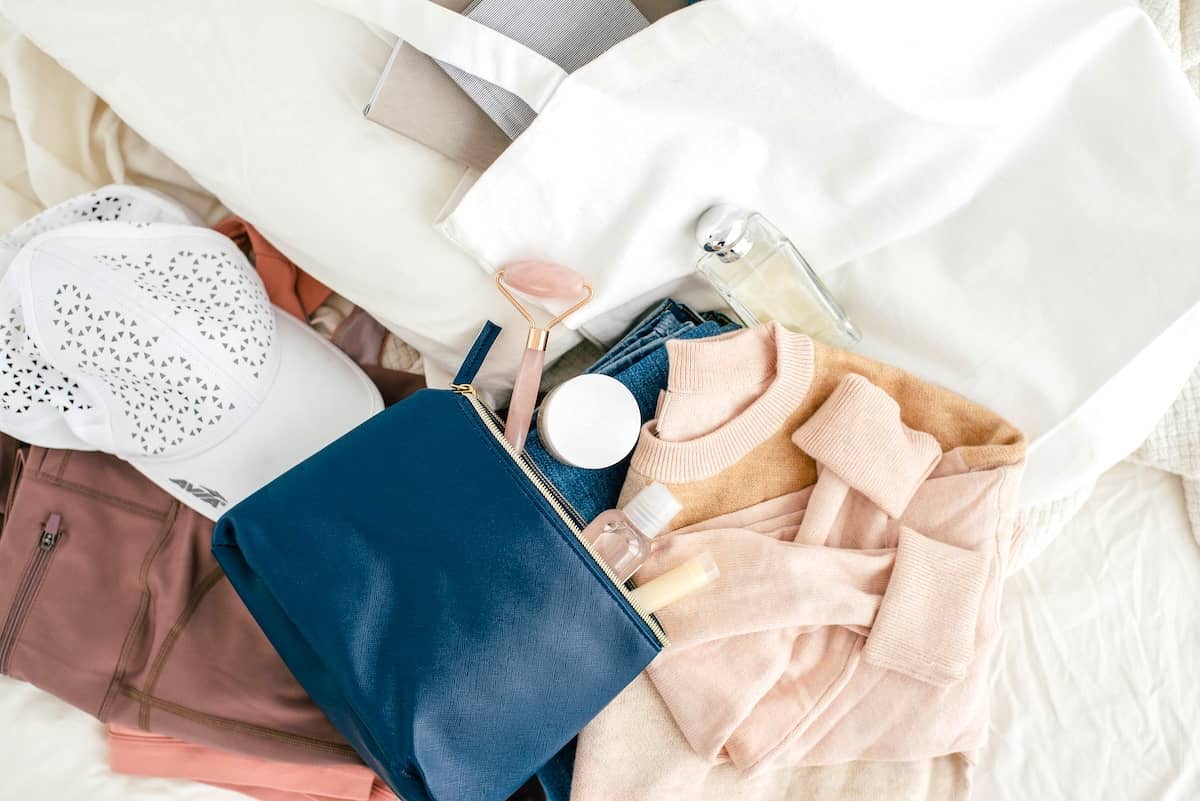 Pile of clothing and makeup - guide to decluttering clothes.