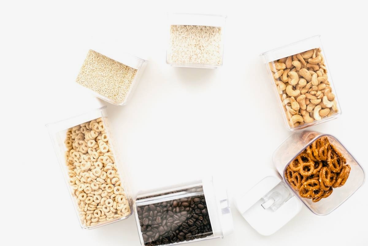 Containers with cereal, pretzels, nuts - pantry organisation ideas.
