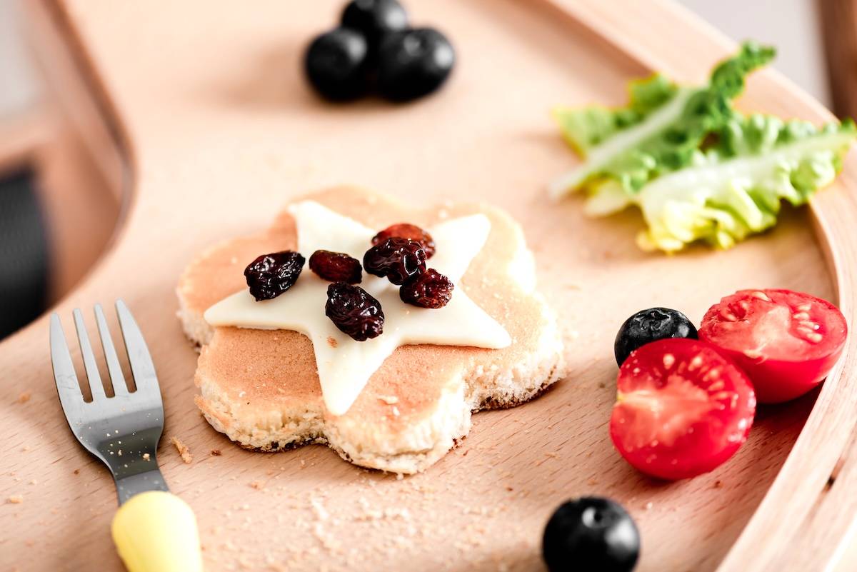 Pancakes decorated with fruit and cheese star - a snack station idea.
