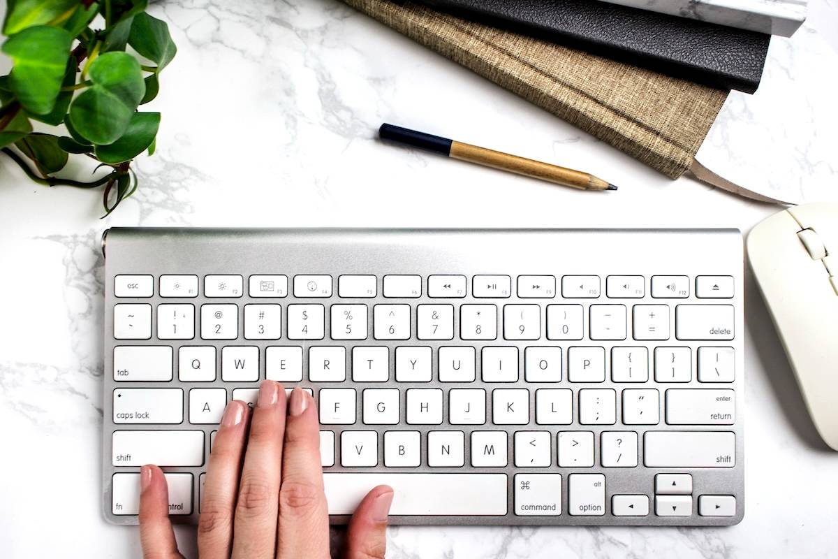 Woman typing on keypad - digital tools you can use.