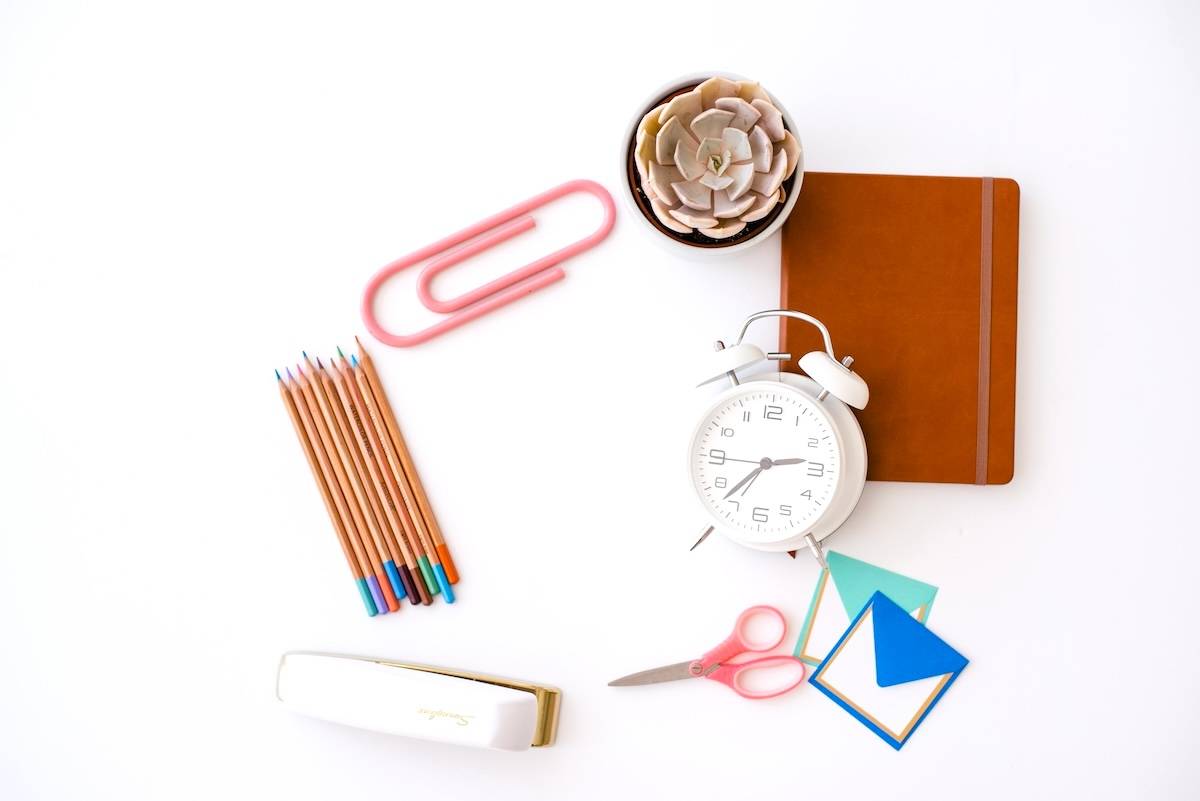 Stationery, clock, notepad - school items to add to an evening routine checklist.
