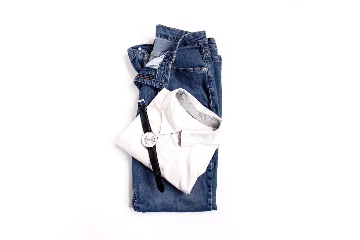 Jeans, t shirt, watch - family organisation items.