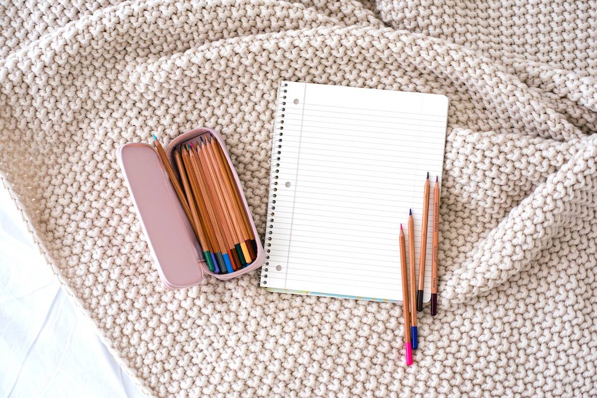 Blanket, notebook, pencils - tips for how to be productive.