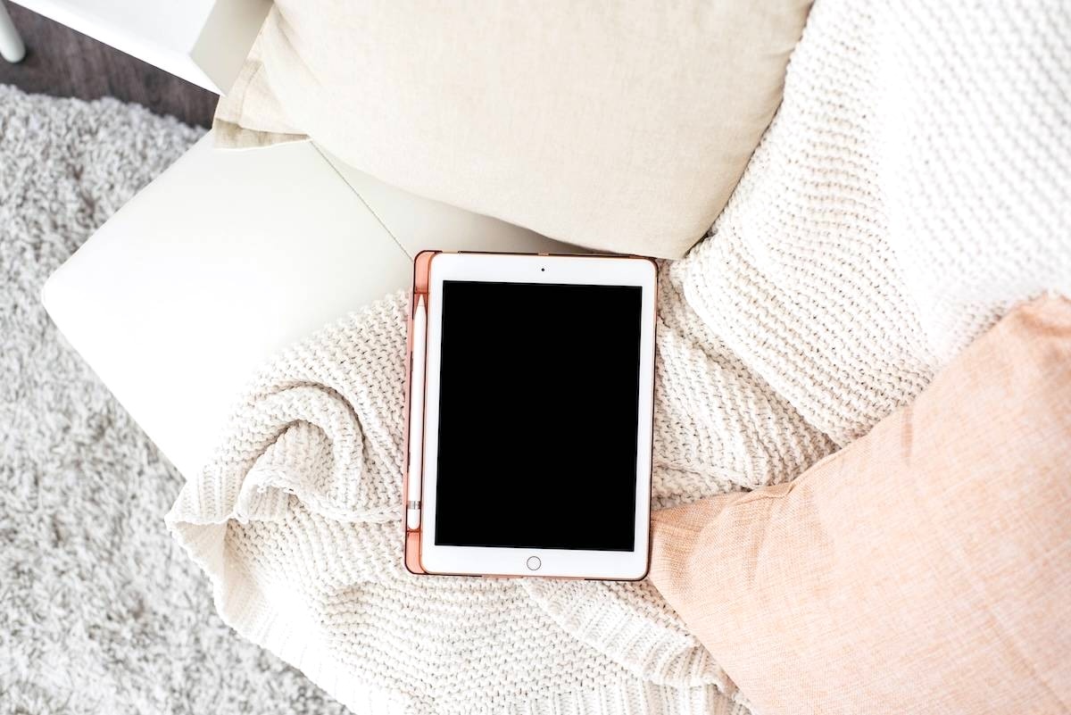 Tablet on sofa - tips for how to declutter your home.