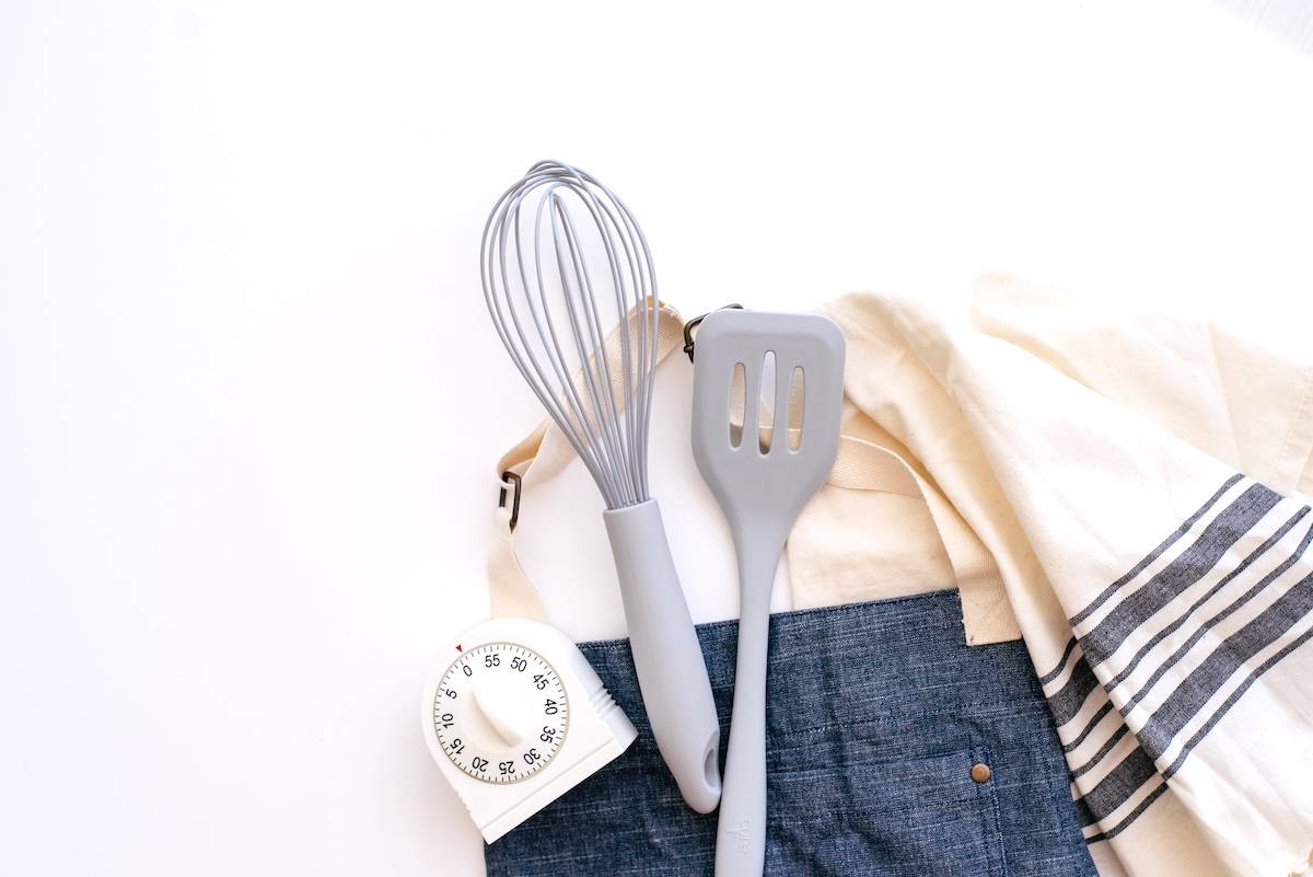 Baking utensils, timer, apron - items needed for family meal planning.