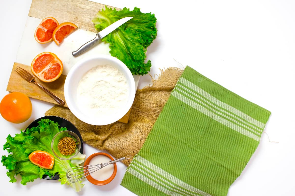 Salad items, chopping board - items needed for family meal planning.