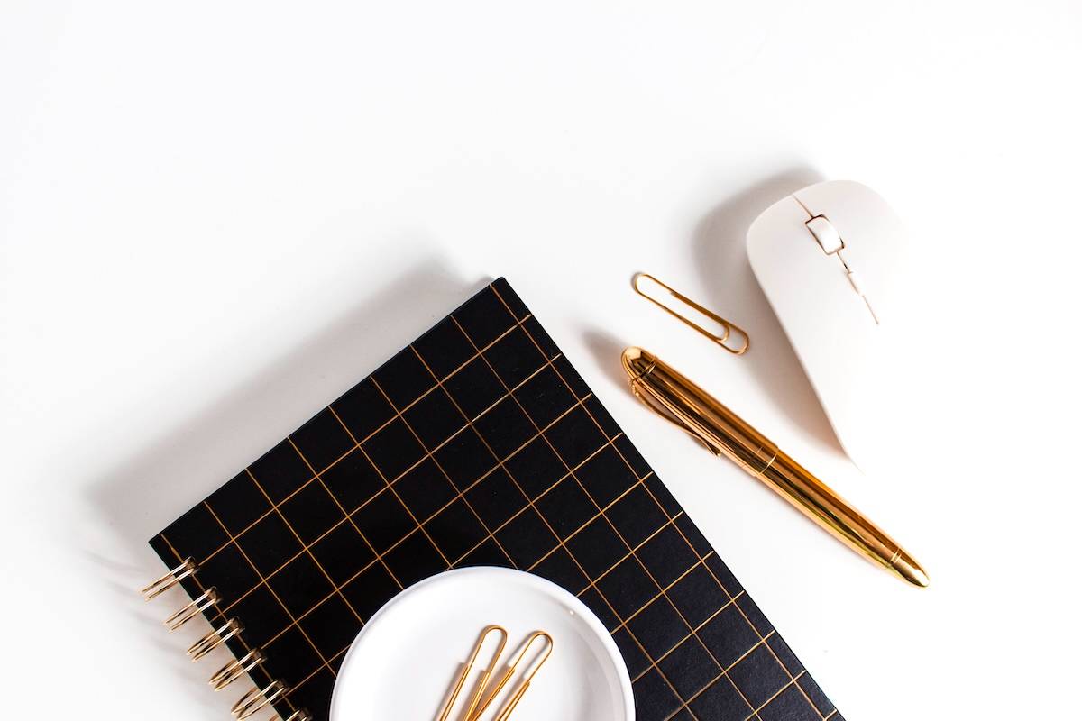 Notebook, mouse, pen - stationery for school supply organisation ideas.
