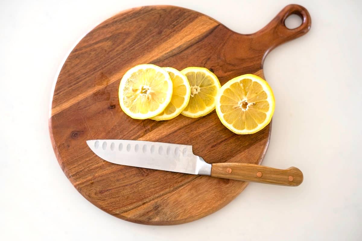 Cutting board with sliced lemons - easy dinner rotation ideas.