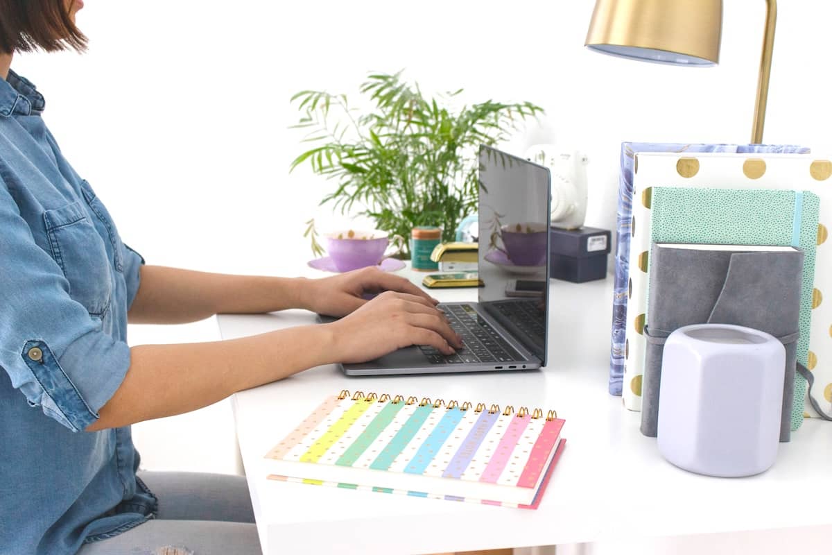 Woman typing - daily routine ideas to try.