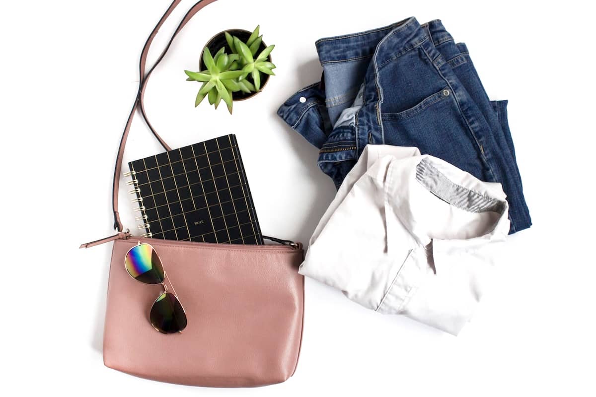 Clothing, bag, notebook - family routine items.
